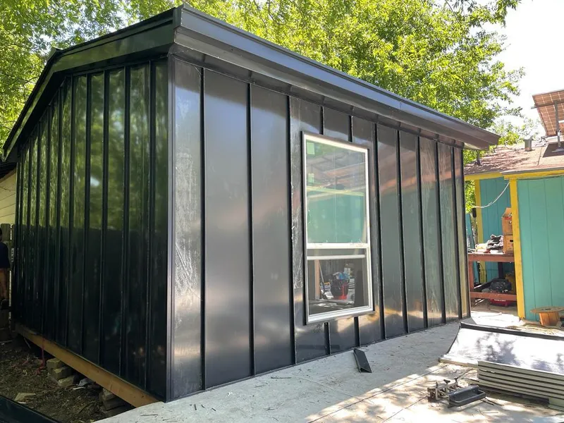 Black standing seam metal wall panels for Roof Inspection in Morrisville