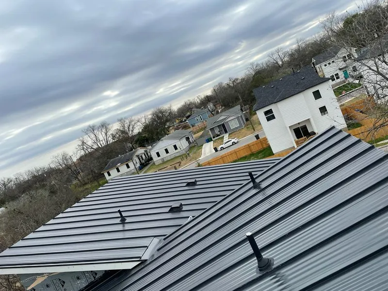 Standing seam metal roof panels with vents for Skylight Repair in Morrisville